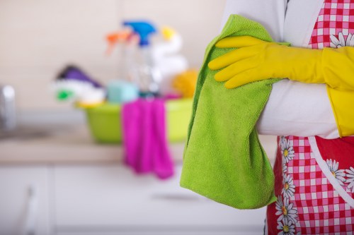 Local curtain cleaning team working in an Acton room